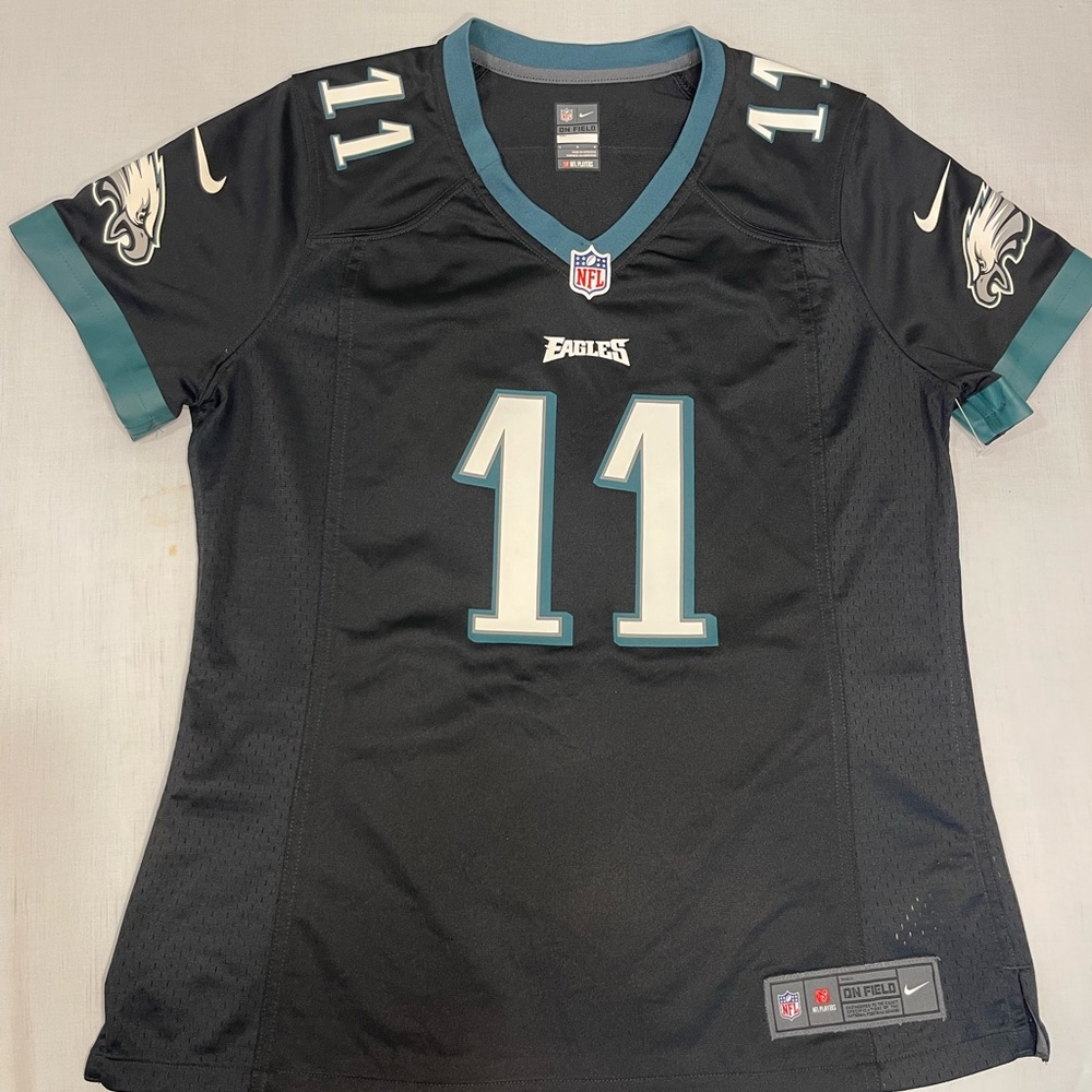 NFL womens Black and Teal Philadelphia Eagles Jersey Large in like new condition